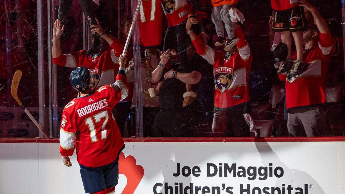 Florida Panthers center Evan Rodrigues (17) gives a fan a hockey stick after defeating the Edmonton Oilers 4 to 1 in Game 2 of the NHL Stanley Cup Finals at the Amerant Bank Arena on Monday, June 10, 2024, in Sunrise, Fla.