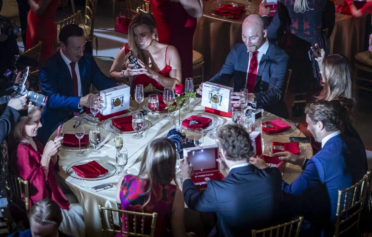 Fort Lauderdale, FL, October 6, 2025 - Panthers players react after seeing their 2025 Championship rings after opening the boxes at their tables during a private championship ring ceremony at War Memorial Auditorium on Monday