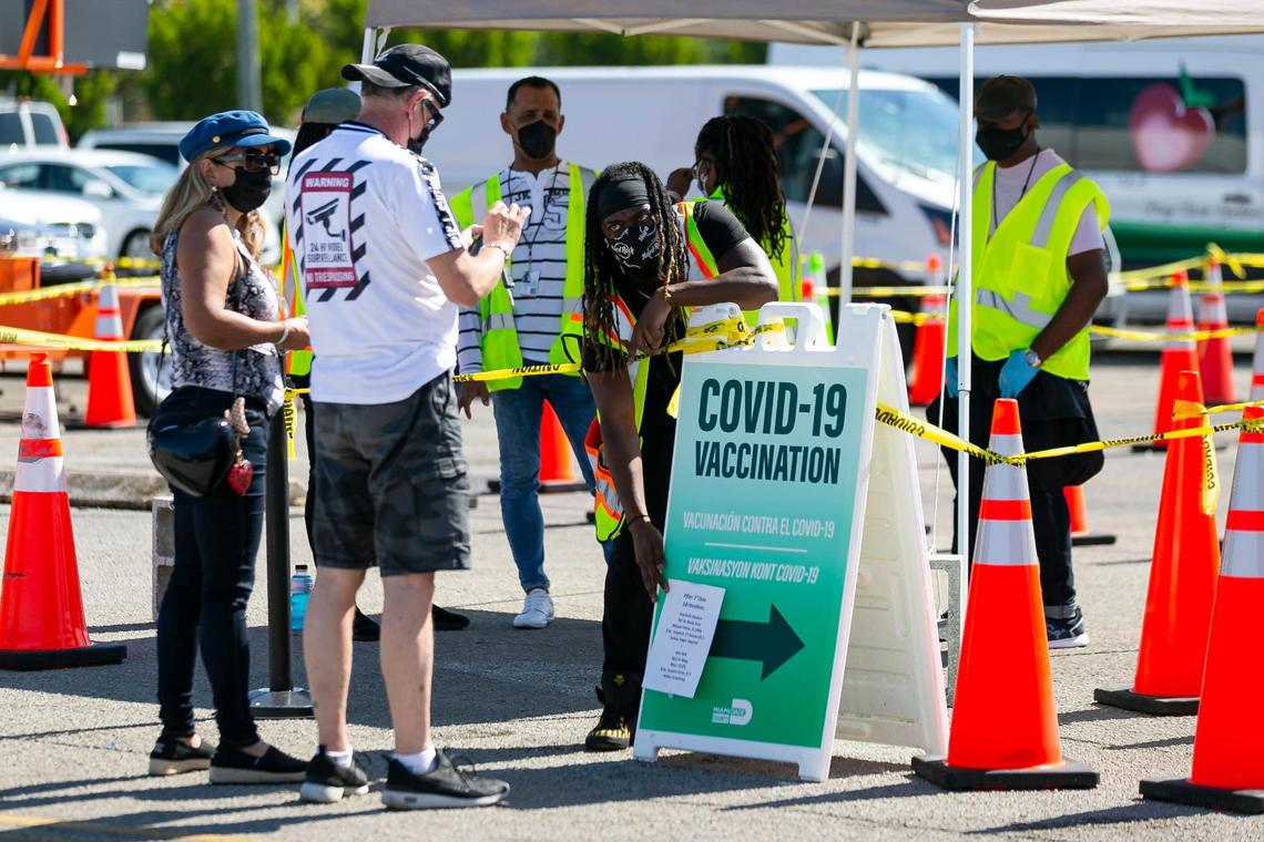 People arrive at the Miami Dade College North vaccination site where the second dose of the Pfizer-BioNTech COVID-19 vaccine is available in Miami on Tuesday, April 13, 2021.