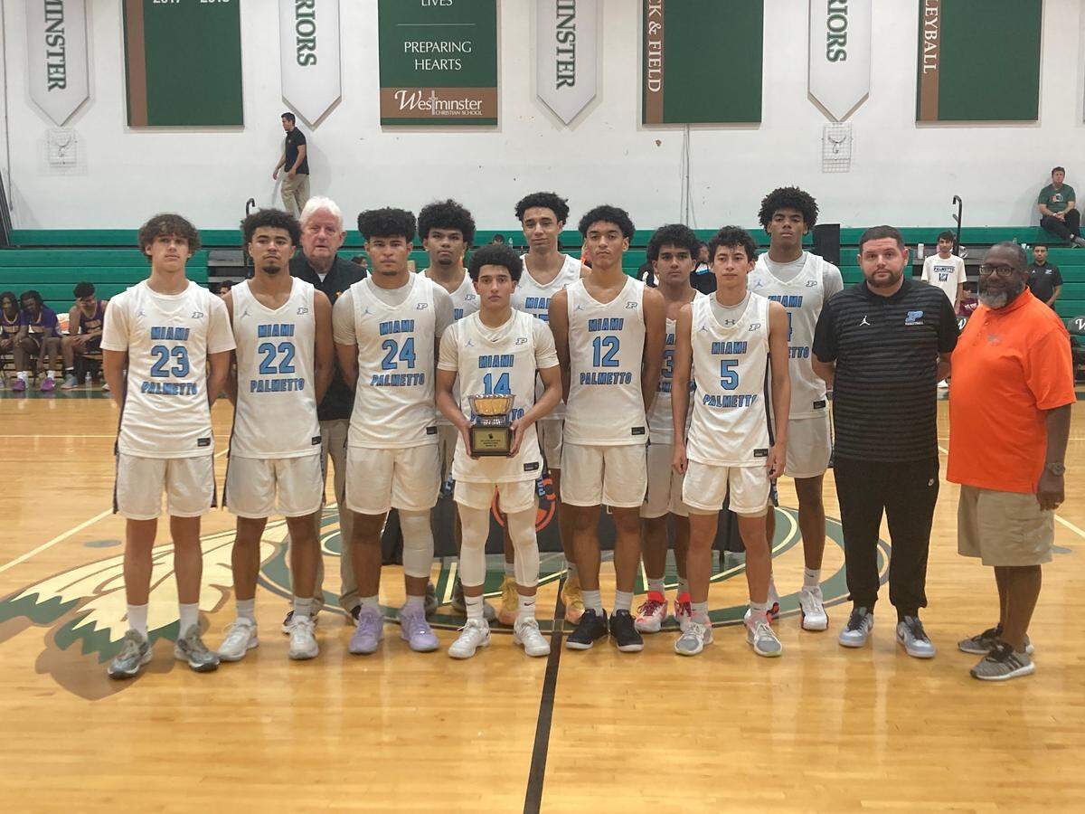 The Miami Palmetto boys’ basketball teams accepts its runner-up trophy after playing in the Junior Orange Bowl basketball tournament at Westminster Christian in Miami, Fla.