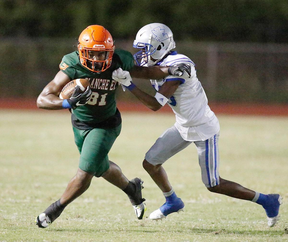 Blanche Ely Tigers Lerry Moise (81) attempts to break free from Fort Lauderdale Flying L’s defender during football game on Friday, September 30, 2022 at Blanche Ely HS in Pompano Beach. Andrew Uloza / for Miami Herald