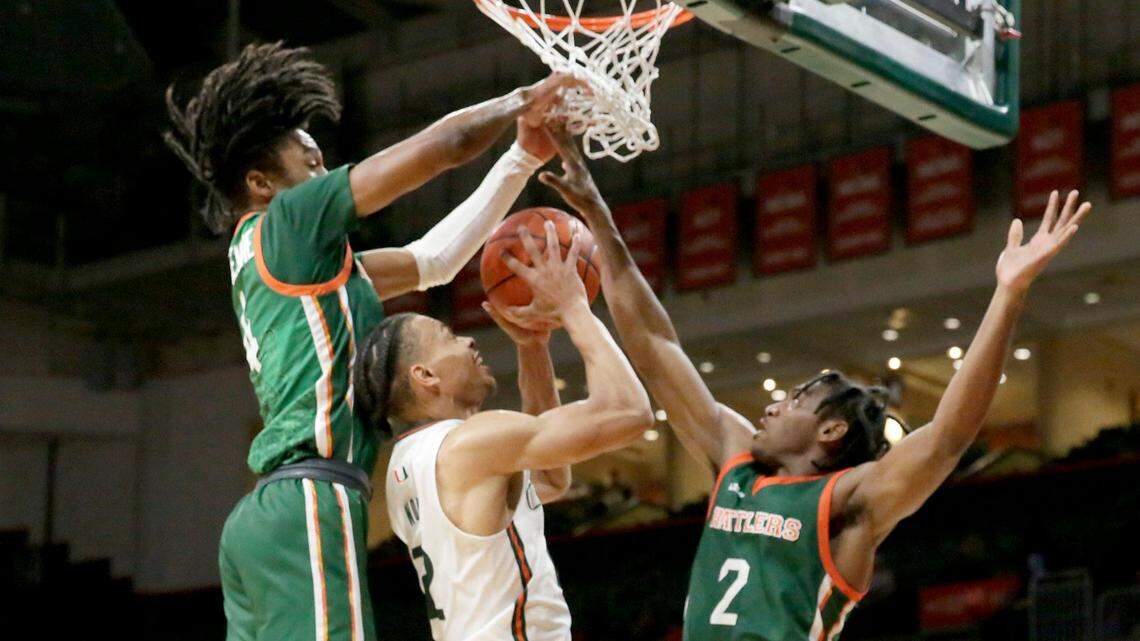 UM Hurricanes Isaiah Wong (2) tries to shoot against Florida A & M Rattlers during basketball game on Tuesday, November 15, 2022 at Watsco Center in Coral Gables. Andrew Uloza / for Miami Herald