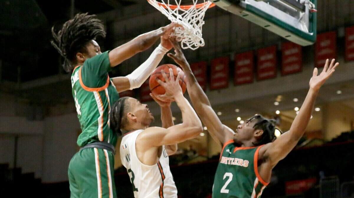 UM Hurricanes Isaiah Wong (2) tries to shoot against Florida A & M Rattlers during basketball game on Tuesday, November 15, 2022 at Watsco Center in Coral Gables. Andrew Uloza / for Miami Herald