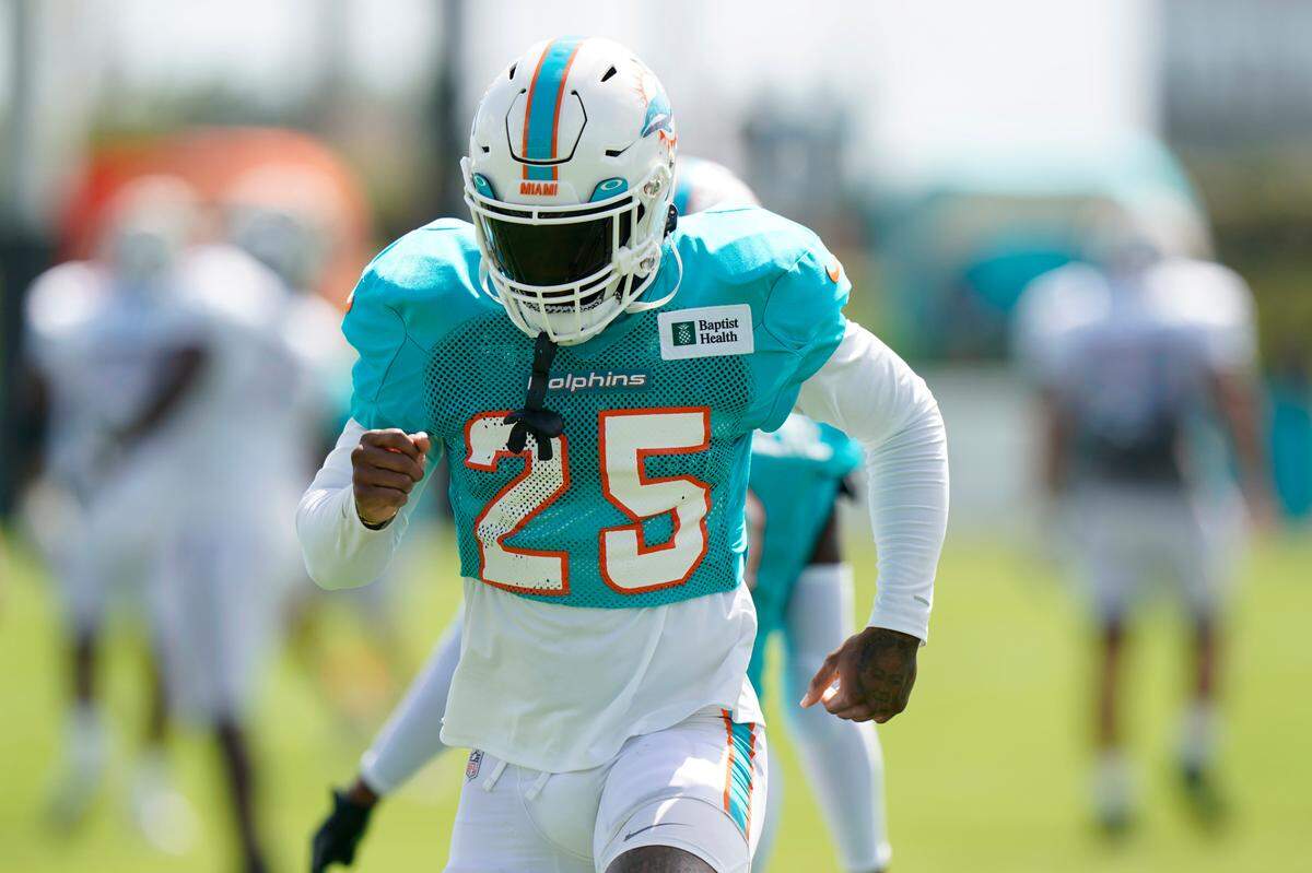 Miami Dolphins cornerback Xavien Howard warms up during drills at the NFL football team’s practice facility, Saturday, Aug. 6, 2022, in Miami Gardens, Fla. (AP Photo/Wilfredo Lee)