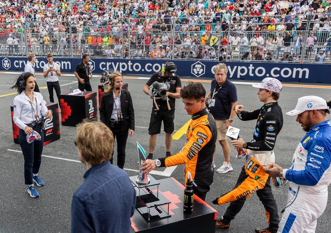 Winner McLaren’s Lando Norris of Great Britain, second place McLaren’s Oscar Piastri of Australia and third place Scuderia Ferrari’s Lewis Hamilton of Great Britain walk back to their garage after the F1 Sprint race on the second day of Formula One Miami Grand Prix weekend, Saturday, May 3, 2025, at the Miami International Autodrome in Miami Gardens, Fla.