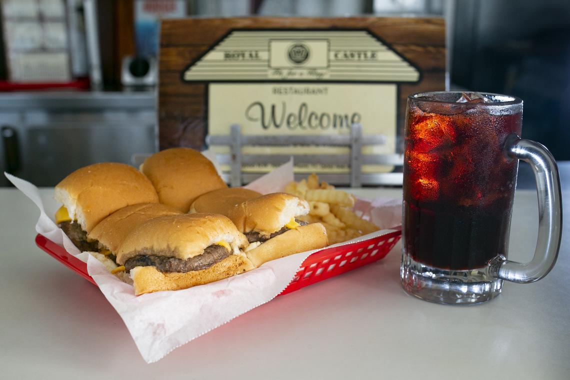 An Original Royal Castle Burger with cheese and Birch Beer was prepared by James S. Brimberry, 27, inside the last Royal Castle restaurant located in Miami’s Gladeview neighborhood. Brimberry’s grandfather, James N. Brimberry, who at one point owned seven Royal Castles, sold him the last location in existence in 2016. Now, James S. Brimberry is looking to attract customers by restoring the restaurant while maintaining its original style.