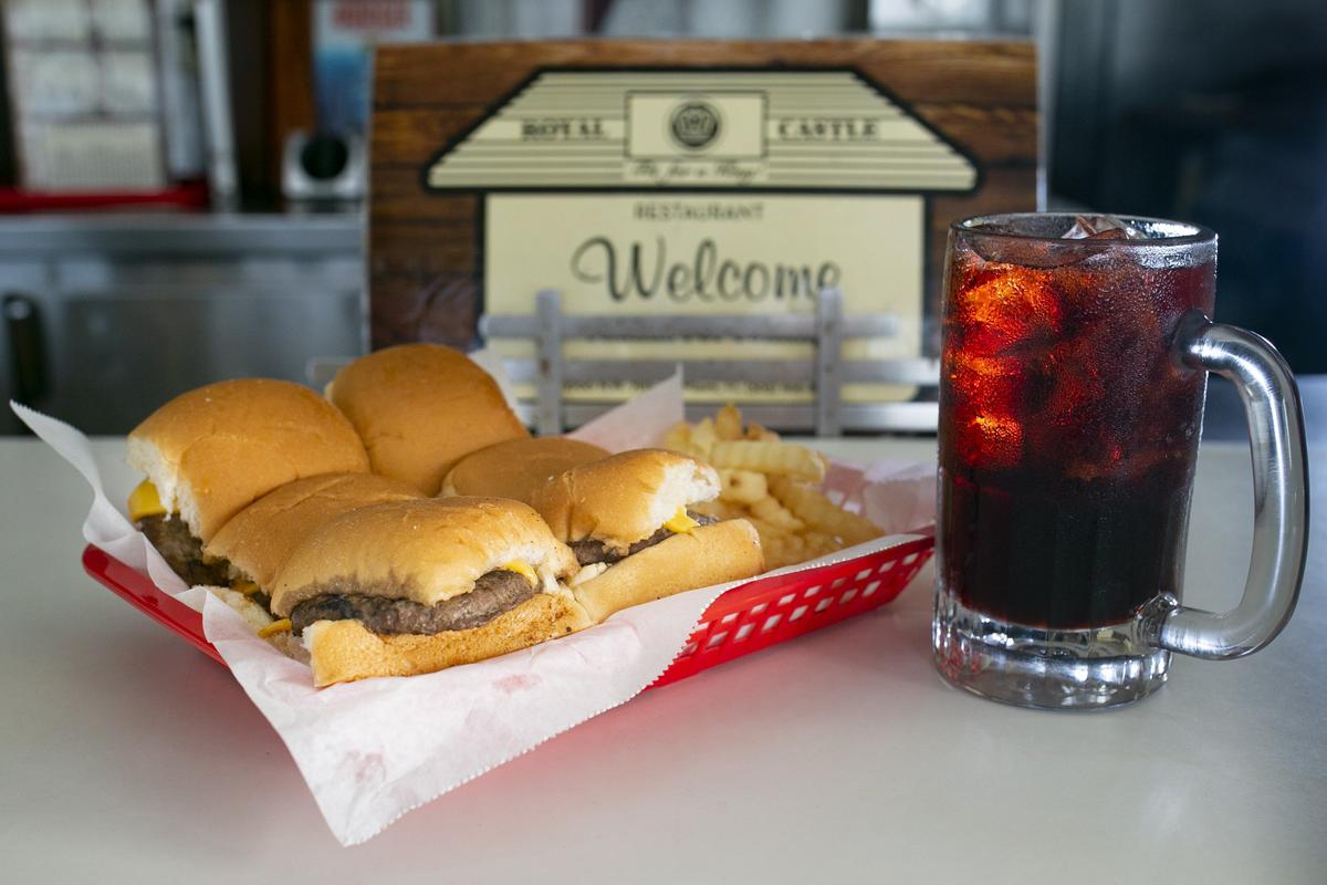 An Original Royal Castle Burger with cheese and Birch Beer.