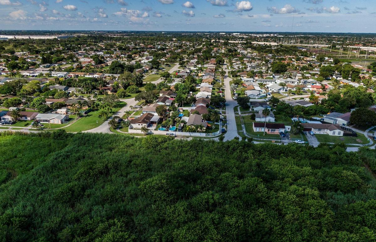 View of a neighborhood next to an extended farm fields located at 26100 SW 112th Ave, Homestead, that is included in a plan to expand the Urban Development Boundary converting farmland into a 9 million-square-foot industrial park near Homestead. on Saturday,October 16, 2021.