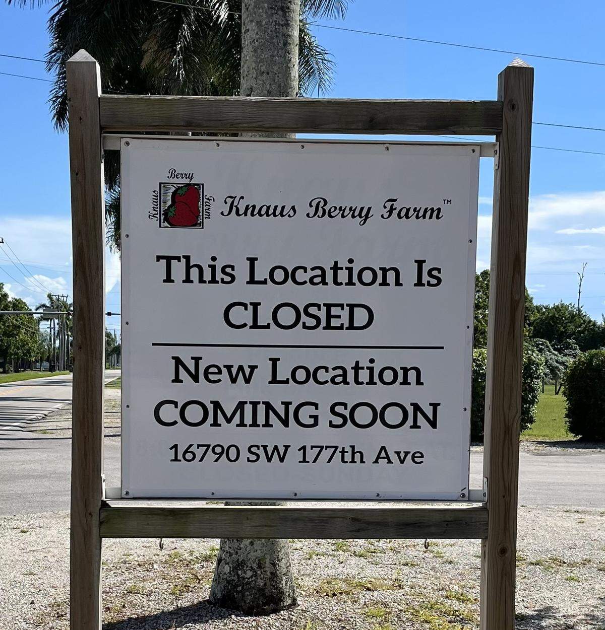 A sign informs customers that Knaus Berry Farm is moving to a new location.