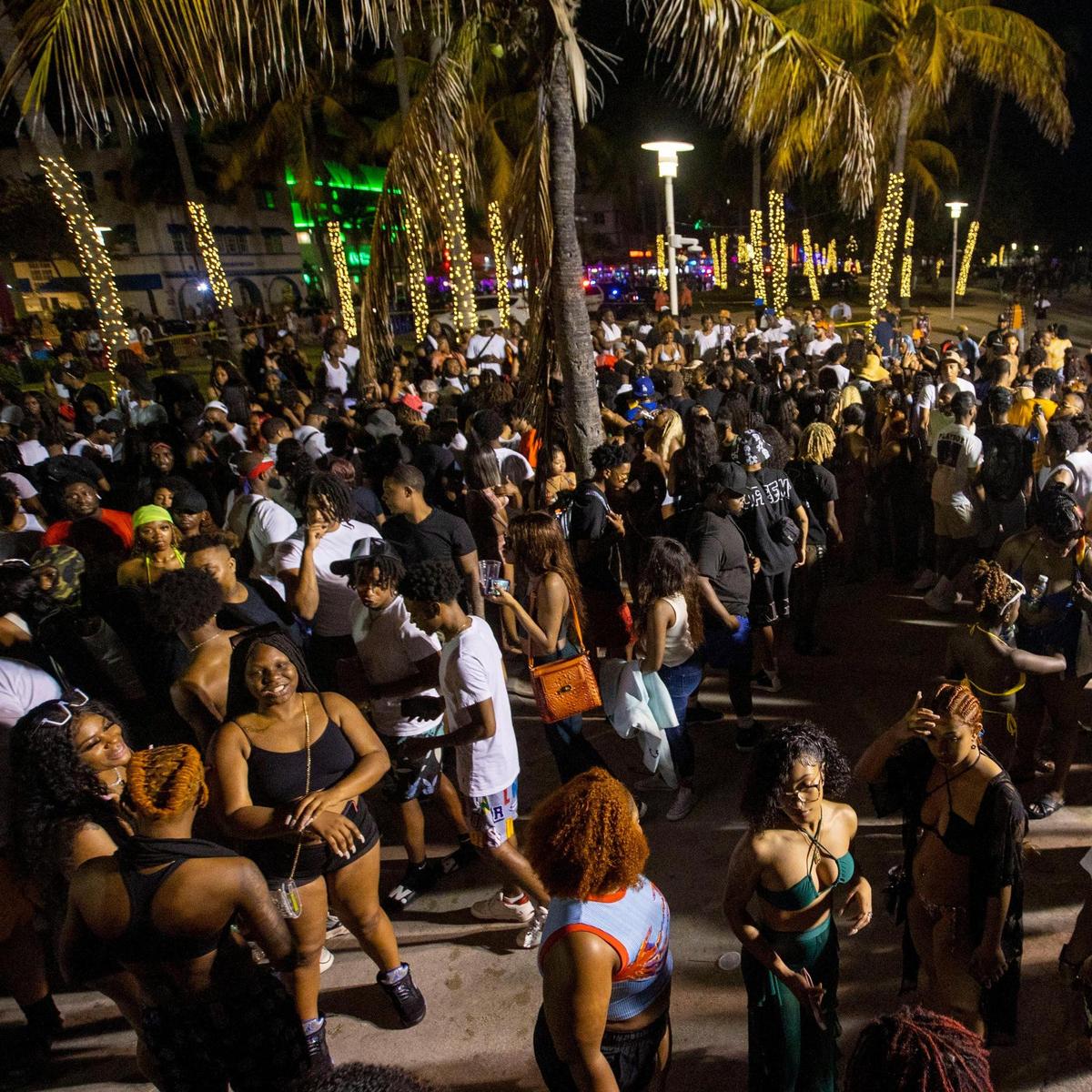 Crowds fill the beach walk along Ocean Drive during Spring Break in Miami Beach, Florida, on Saturday, March 19, 2022.
