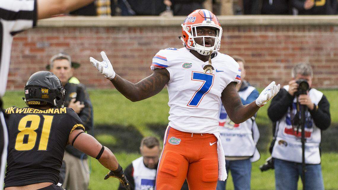 Florida defensive back Duke Dawson, right, is flagged for pass interference on Missouri tight end Albert Okwuegbunam, left, during the second quarter of an NCAA college football game Saturday, Nov. 4, 2017, in Columbia, Mo.