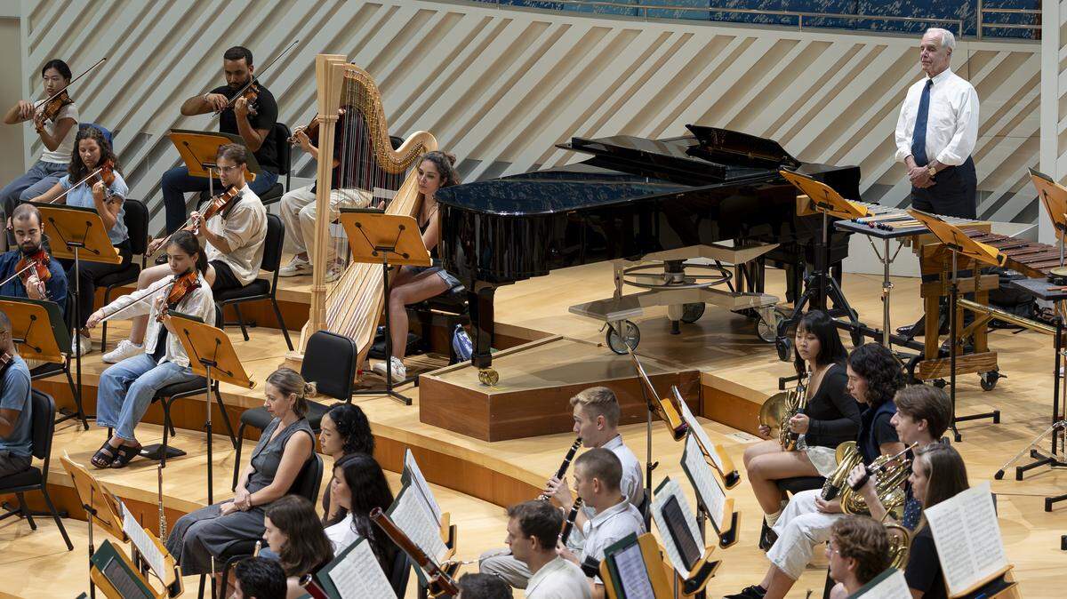 Howard Herring, president and CEO of the New World Symphony, top right, listens as fellows rehearse at the New World Center on Tuesday, Sept. 2, 2025, in Miami Beach, Fla.