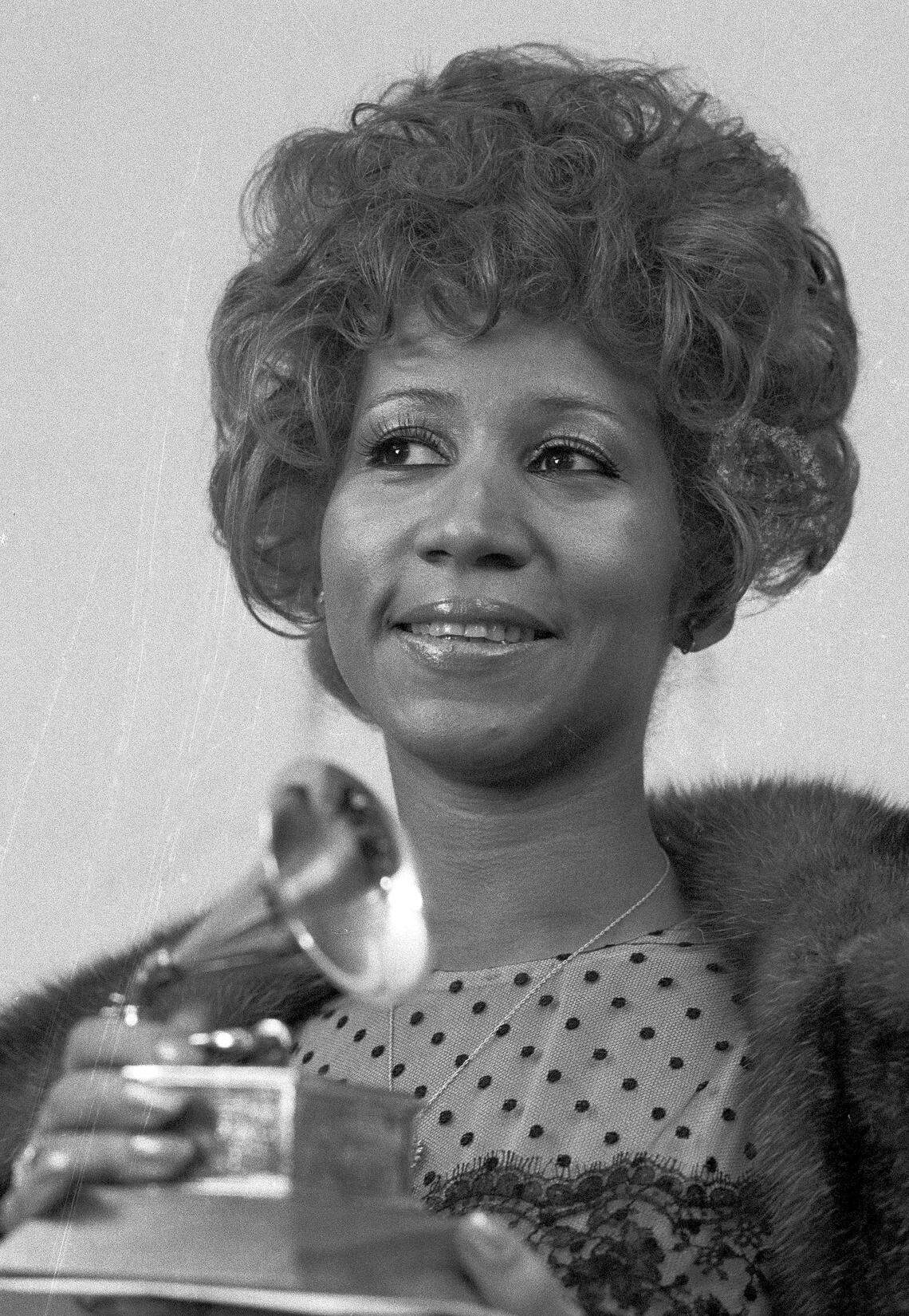 In this March 13, 1972, file photo, Aretha Franklin holds her Grammy Award for Best R&B performance of the song “Bridge Over Troubled Water,” in New York. The song was produced and engineered by her core Miami team of Jerry Wexler, Arif Mardin and Tom Dowd. She’d win other Grammys for works recorded at North Miami’s Criteria Studios in this time period.