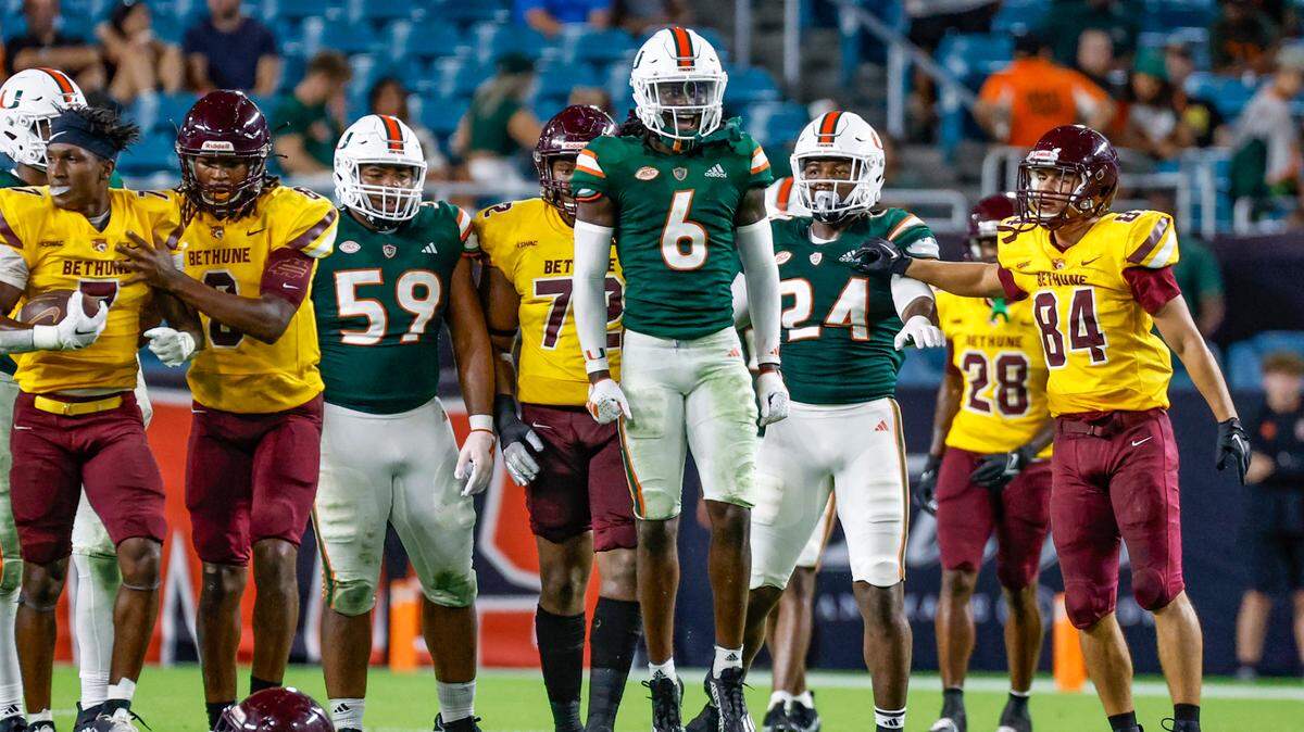Miami Hurricanes defensive back Damari Brown (6) reacts after taking down Bethune Cookman Wildcats running back Terry Lindsey (7) in the second half at Hard Rock Stadium in Miami Gardens, Florida on Thursday, September 14, 2023.