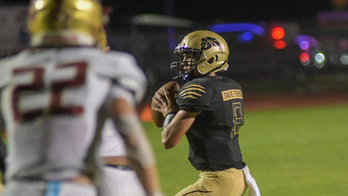 Western quarterback Collin Hurst looks to throw against Johns Creek on Thursday, Aug. 25, 2022.