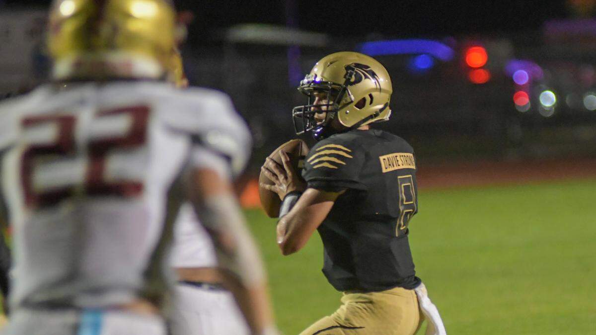 Western quarterback Collin Hurst looks to throw against Johns Creek on Thursday, Aug. 25, 2022.