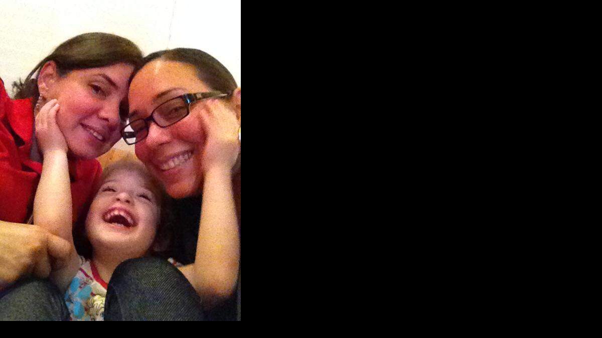 
Partners for almost 18 years, Elsie and Christina Ruiz, pictured with 4-year-old daughter Meredith, hope to finally marry this year now that same-sex marriages are legal in Florida.
