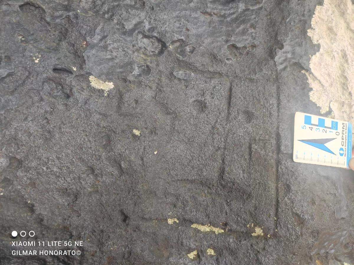 A slightly worn rectangular face carving.