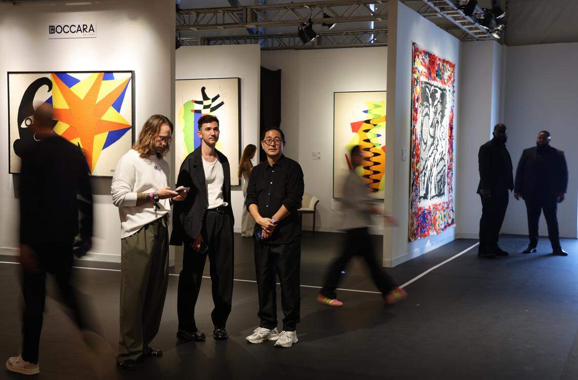 Miami Beach, FL, December 2, 2025 - The wait is over as the 20th Anniversary edition of Design Miami opens its doors on the first day of Miami Art Week in Miami Beach, Florida. Visitors take in the variety of interior design galleries while standing near the Boccara Gallery featuring the hand-woven tapestry “Moon and Star” by Alexander Calder.