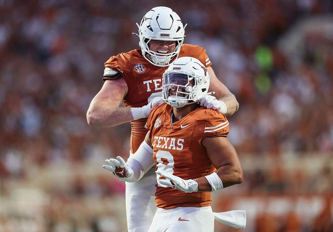 AUSTIN, TEXAS - SEPTEMBER 20: Ethan Burke #91 of the Texas Longhorns congratulates Trey Moore #8 after a tackle in the first quarter against the Sam Houston State Bearkats at Darrell K Royal-Texas Memorial Stadium on September 20, 2025 in Austin, Texas. (Photo by Tim Warner/Getty Images)