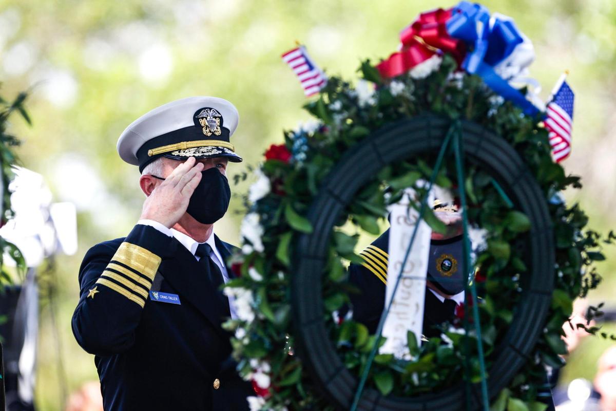 U.S. Southern Command’s commander, Navy Adm. Craig Faller salutes after wreaths were presented during a 9/11 Ceremony of Remembrance at Tropical Park in Miami, Florida on Saturday, September 11, 2021.