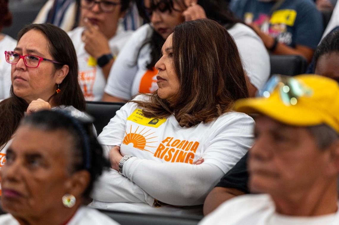 People representing Florida Rising wait for the chance to speak during public comment during a Miami-Dade County Commission meeting at the Stephen P. Clark Government Center on Thursday, June 26, 2025, in Miami.
