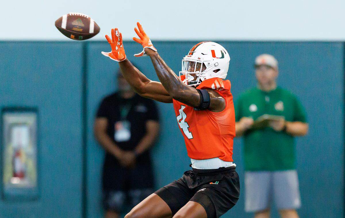 Miami Hurricanes wide receiver Colbie Young (4) participates in a drill during fall training camp at the Carol Soffer Indoor Practice Facility at the University of Miami on Wednesday, August 2, 2023 in Coral Gables, Florida.
