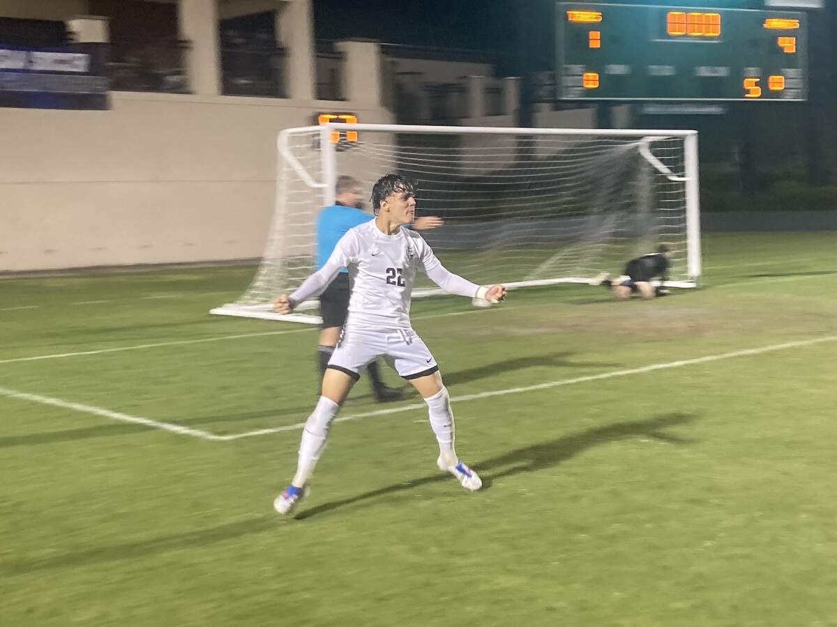 Pembroke Pines Charter player Renzo Vicencio celebrates after hitting the game-clinching penalty kick for his team in a Class 5A state semifinal on Friday against Tampa Jesuit.