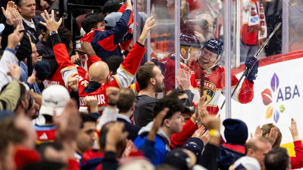 Florida Panthers center Aleksander Barkov (16) and center Carter Verhaeghe (23) celebrate after scoring a goal against Colorado Avalanche in the third period of their NHL game at the Amerant Bank Arena on Saturday, Feb. 10, 2024, in Sunrise, Fla.