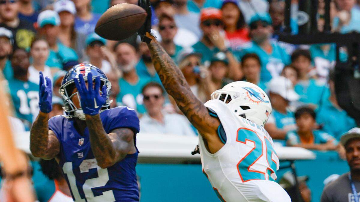 Miami Dolphins cornerback Xavien Howard (25) blocks a pass to New York Giants tight end Darren Waller (12) at Hard Rock Stadium in Miami Gardens on Sunday, October 8, 2023.