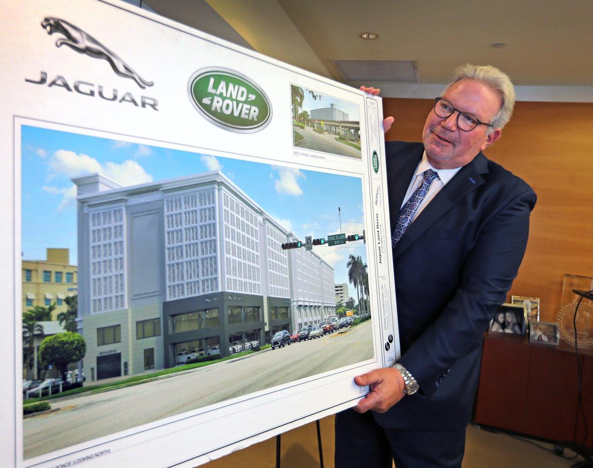 Ken Gorin, president & CEO at The Collection, holds an architectural rendering of the dealership’s planned new stand-alone Jaguar and Land Rover shop on U.S. 1 and Ponce de Leon Boulevard in Coral Gables.