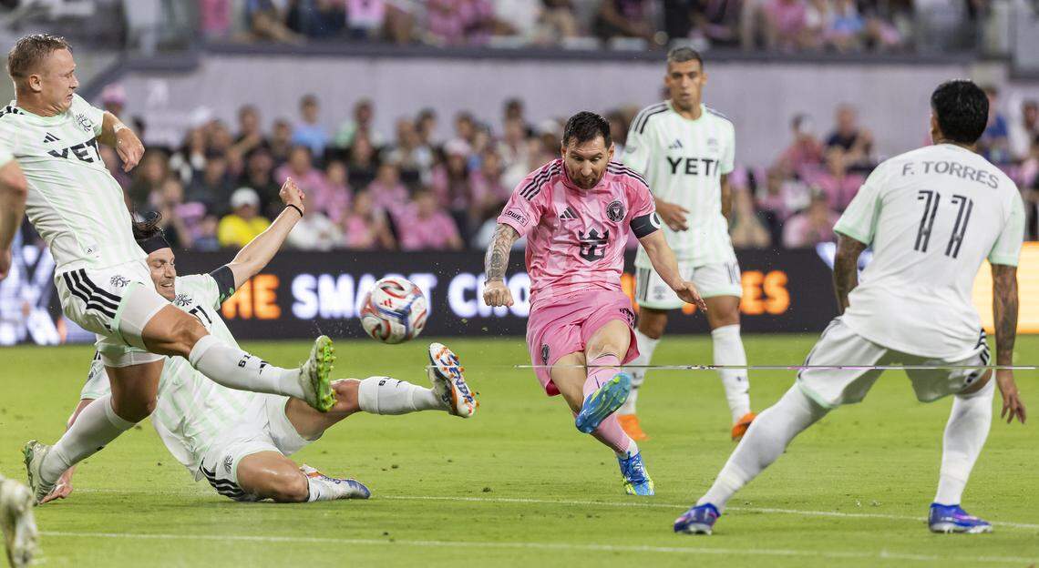 Inter Miami CF forward Lionel Messi (10) shoots the ball as Austin FC midfielder Ilie Sánchez (6) defends in the first half of their MLS match at Nu Stadium in Miami Freedom Park on Saturday, April 4, 2026, in Miami, Fla.