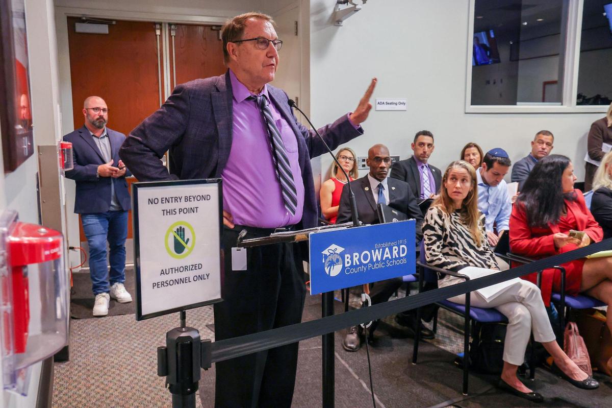 Plantation Mayor Nick Sortal, left, gives his remarks regarding the repurposing and closing of schoolsin Broward County.