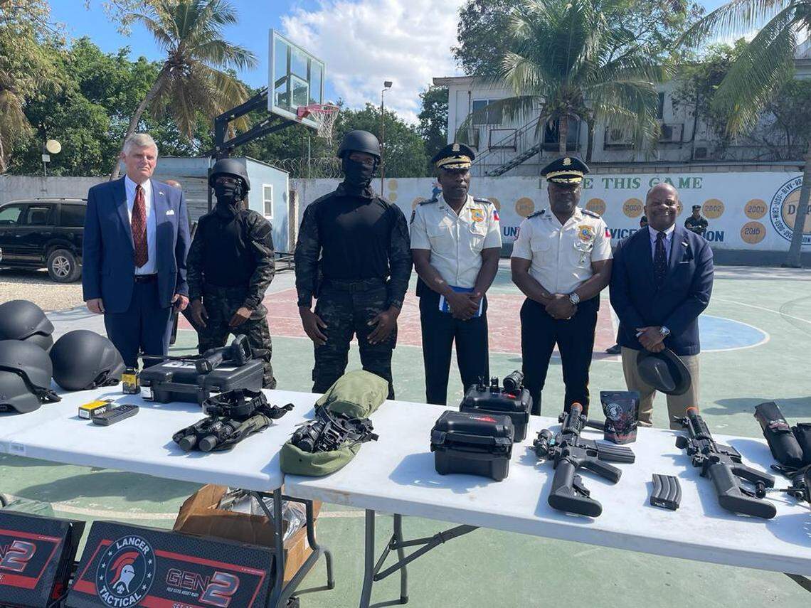  Todd Robinson, assistant secretary for the Bureau of International Narcotics and Law Enforcement, (far right) visits the training grounds of Haiti’s new SWAT on Thursday, January 27, 2023 where he reviewed some of the police equipment the United States is providing including new uniforms for the specialized force and night goggles. 