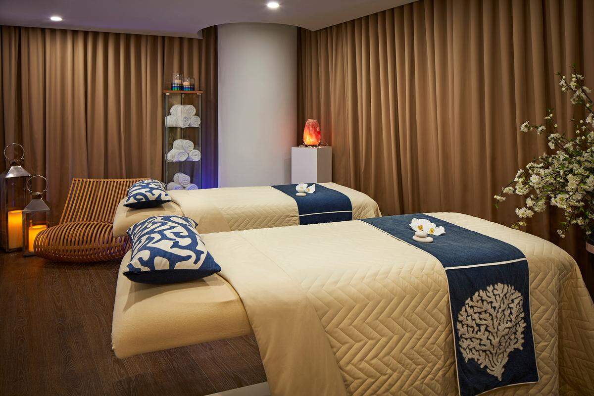 A cozy massage room at Dermanova Spa & Salon.