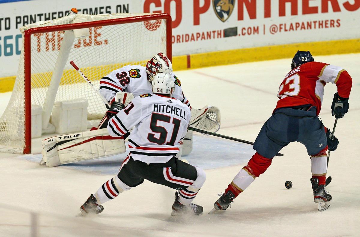 Florida Panthers Carter Verhaeghe (23) scores on Chicago Blackhawks goalie Kevin Lankinen (32) in the first period at the BB&T Center in Sunrise, Florida, Tuesday, January 19, 2021.