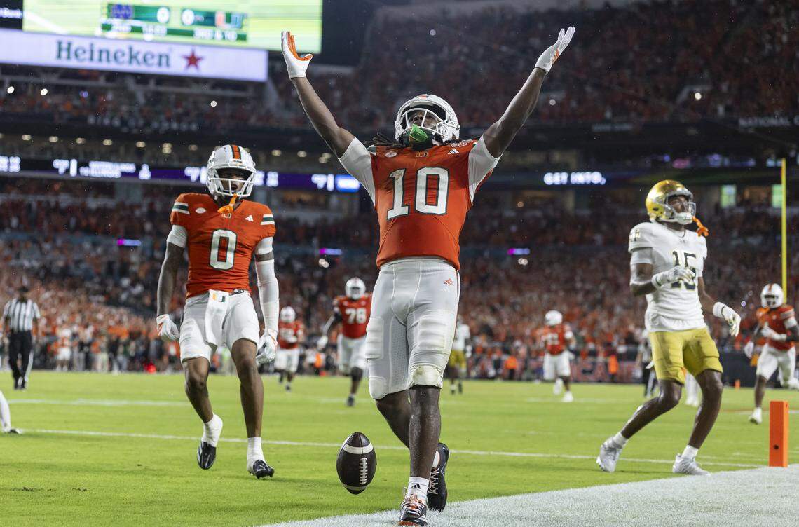 Miami Hurricanes wide receiver Malachi Toney (10) celebrates after scoring a touchdown against the Notre Dame Fighting Irish in the first half of their NCAA football game at Hard Rock Stadium on Sunday, Aug. 31, 2025, in Miami Gardens, Fla.