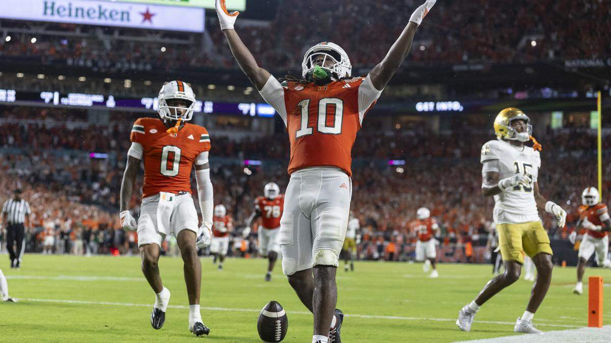 Miami Hurricanes wide receiver Malachi Toney (10) celebrates after scoring a touchdown against the Notre Dame Fighting Irish in the first half of their NCAA football game at Hard Rock Stadium on Sunday, Aug. 31, 2025, in Miami Gardens, Fla.
