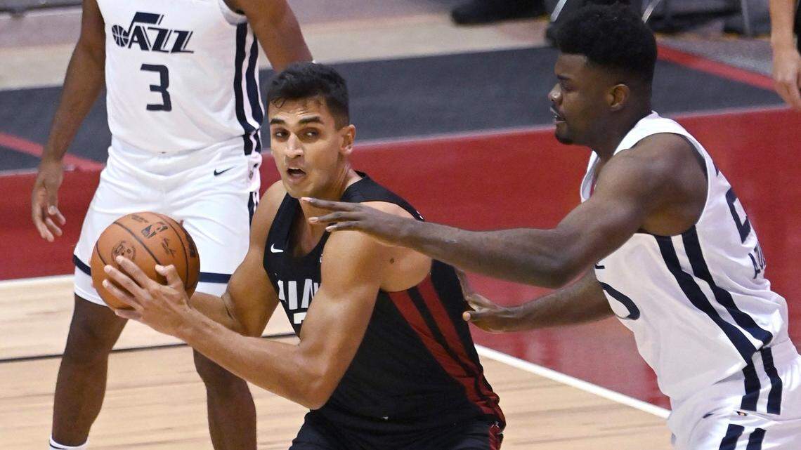 Miami Heat center Omer Yurtseven is defended by Utah Jazz center Udoka Azubuike during the first half of an NBA summer league basketball game Friday, Aug. 13, 2021, in Las Vegas.