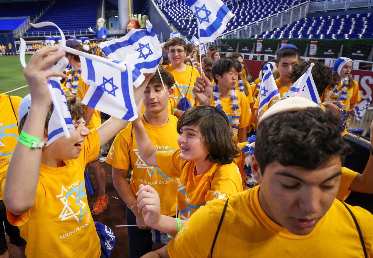 David Posnack Jewish Day School students parade into the baseball park.