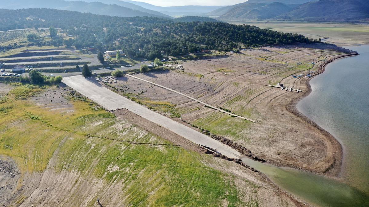 A drought has brought back an underwater Utah ghost town for the first time in 64 years. (Credit: Devon Dewey)