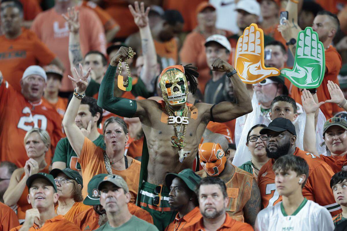 Miami Hurricanes fans show their support during an NCAA football game against the Notre Dame Fighting Irish at Hard Rock Stadium in Miami Gardens, Florida, on Sunday, August 31, 2025. 