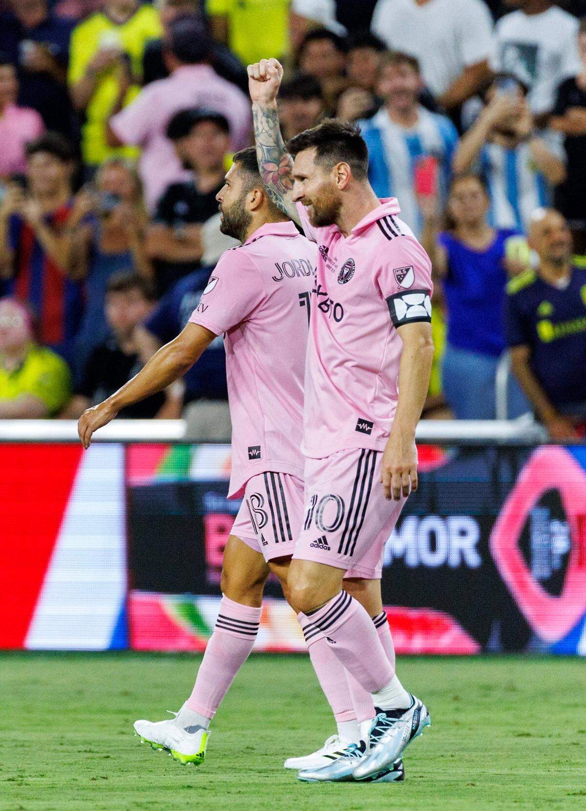 Lionel Messi celebrates with teammate Jordi Alba. Messi has scored 10 goals in his first seven games with Inter Miami.