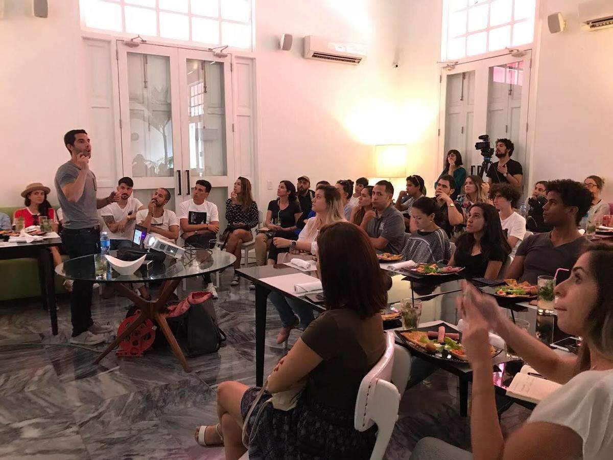 Andrei Santalo leads a discussion on social media marketing for a group of 70 Cuban entrepreneurs.