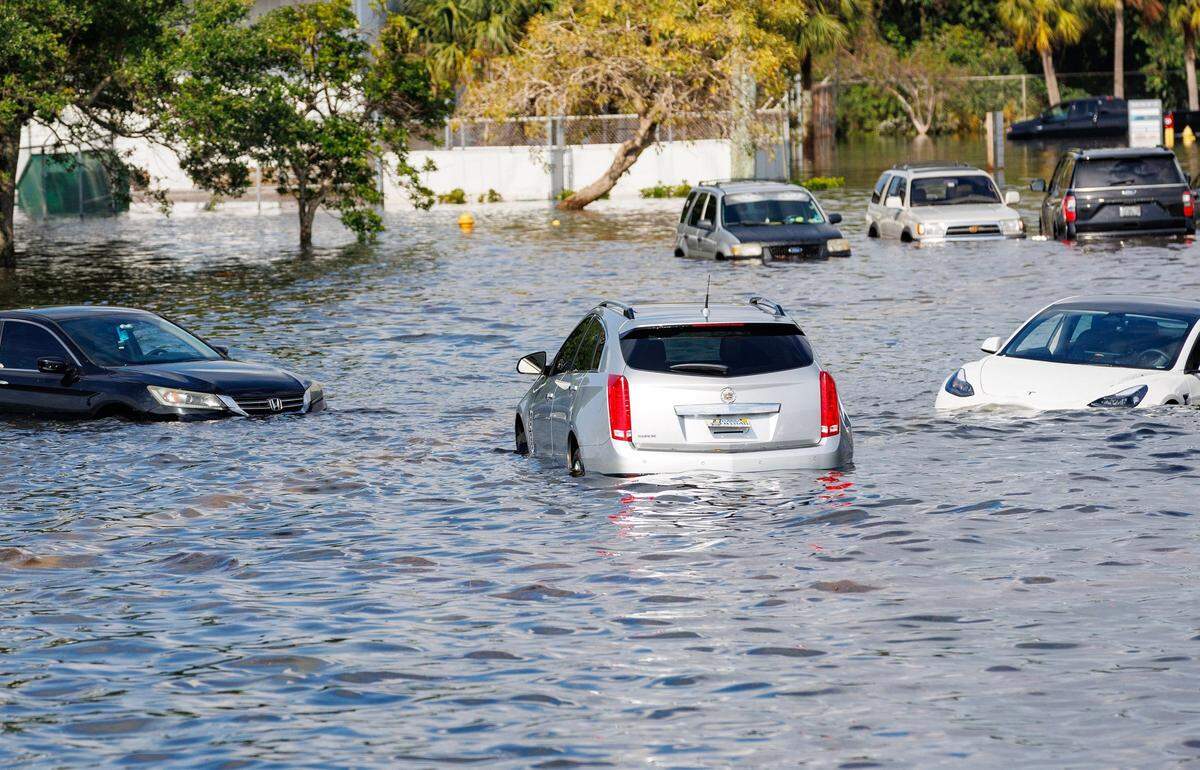 Vehicles submerged in flooded street caused by heavy rain on West Perimeter Road in Fort Lauderdale on Thursday, April 13, 2023.