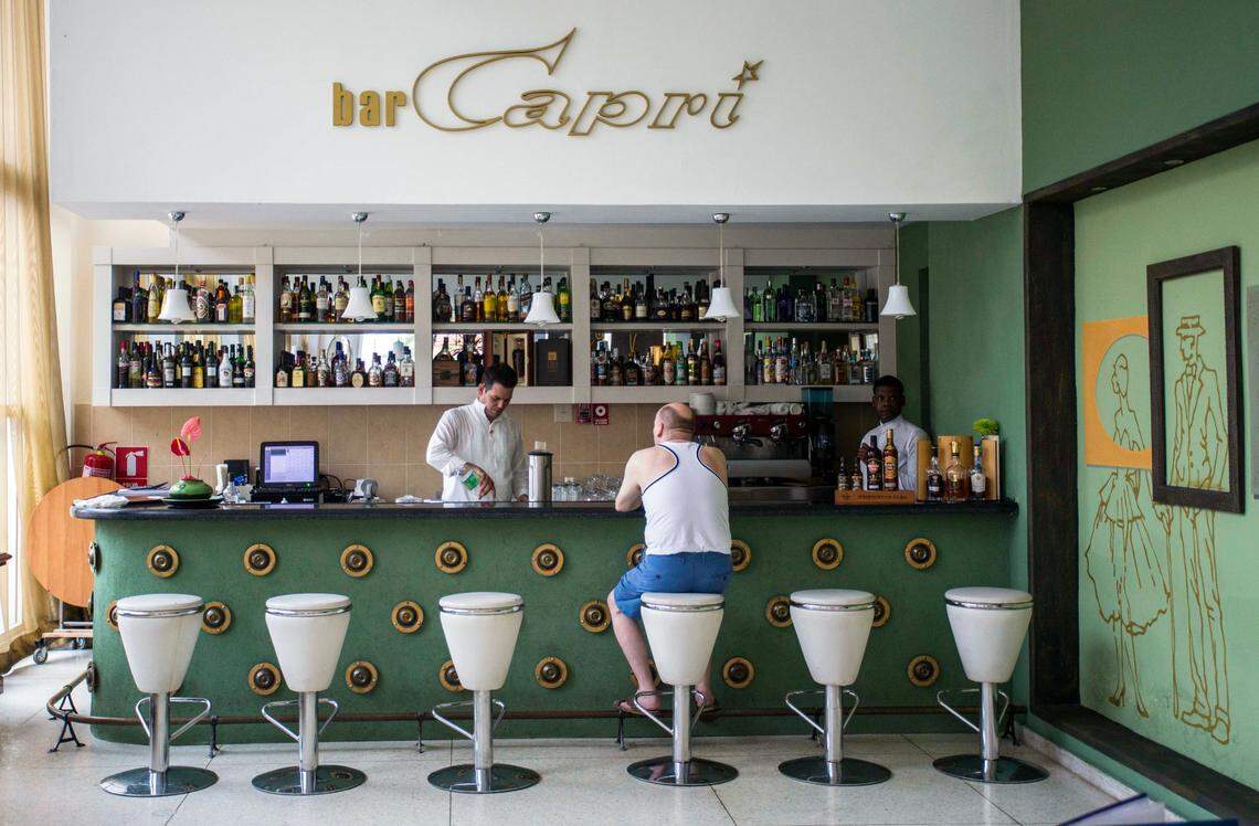 In this Sept. 12, 2017, file photo, a customer sits at the lobby bar of the Hotel Capri in Havana, Cuba, where an American official reported being the victim of what was later labeled Havana Syndrome.