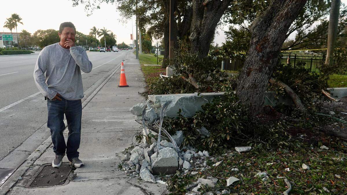 Juan Alcocer, father of Richard Manuel Alcocer, 18, arrives at the bus stop on Tuesday, a day after his son died in a crash at the site. (Joe Cavaretta/South Florida Sun Sentinel)