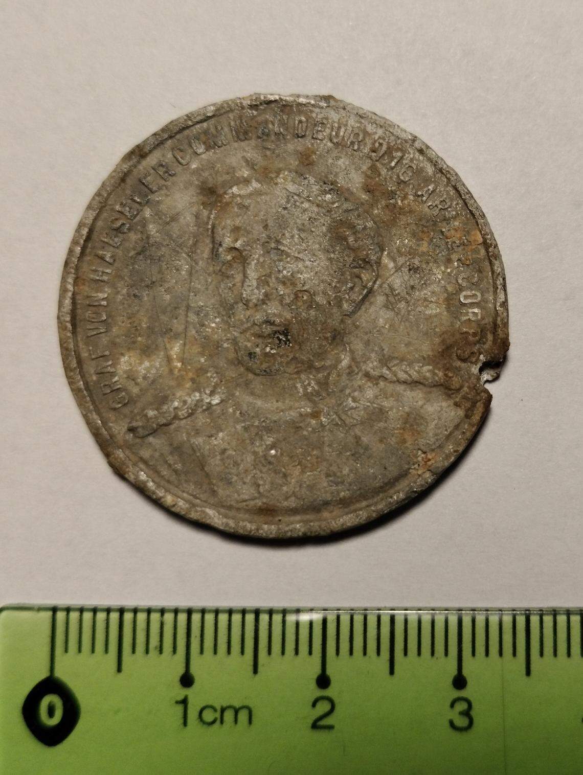 An aluminum medal from 1900 commemorating an army leader.