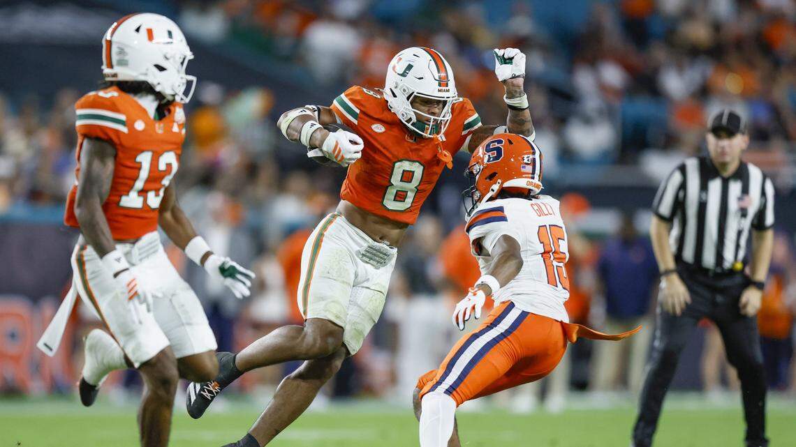 Miami Hurricanes defensive back Jakobe Thomas (8) returns an interception in the second half of an NCAA football game against the Syracuse Orange at Hard Rock Stadium in Miami Gardens, Florida on Saturday, November 8, 2025.