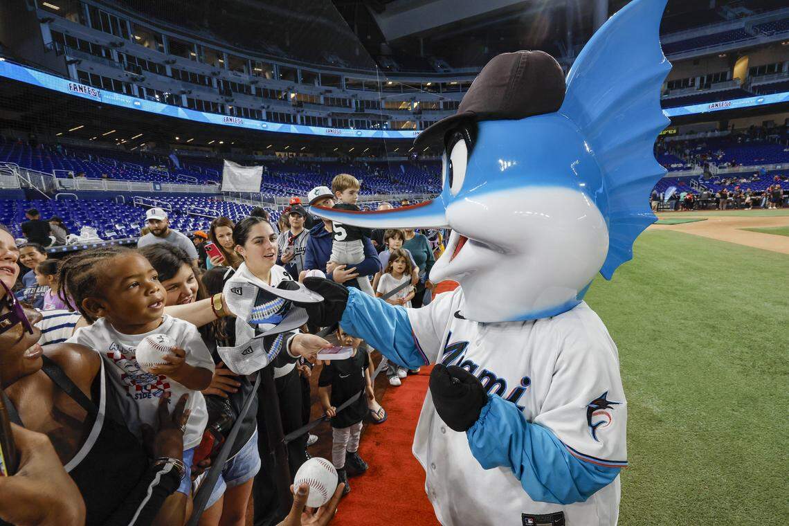 Billy the Marlin signs autographs on the field during Marlins Fan Fest at loanDepot park in Miami on Saturday, February 7, 2026. 